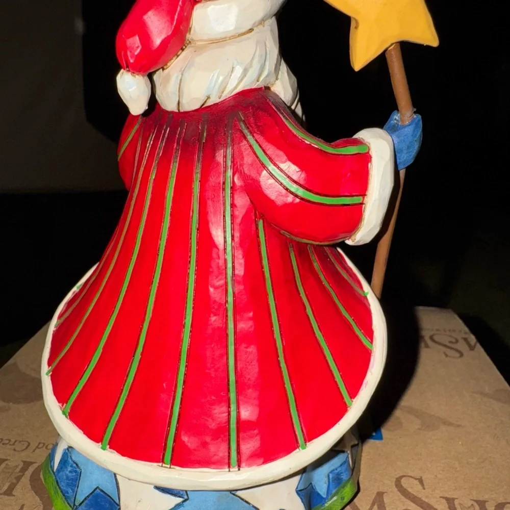 Jim Shore Santa Figurine with Star please look. Closely at pictures